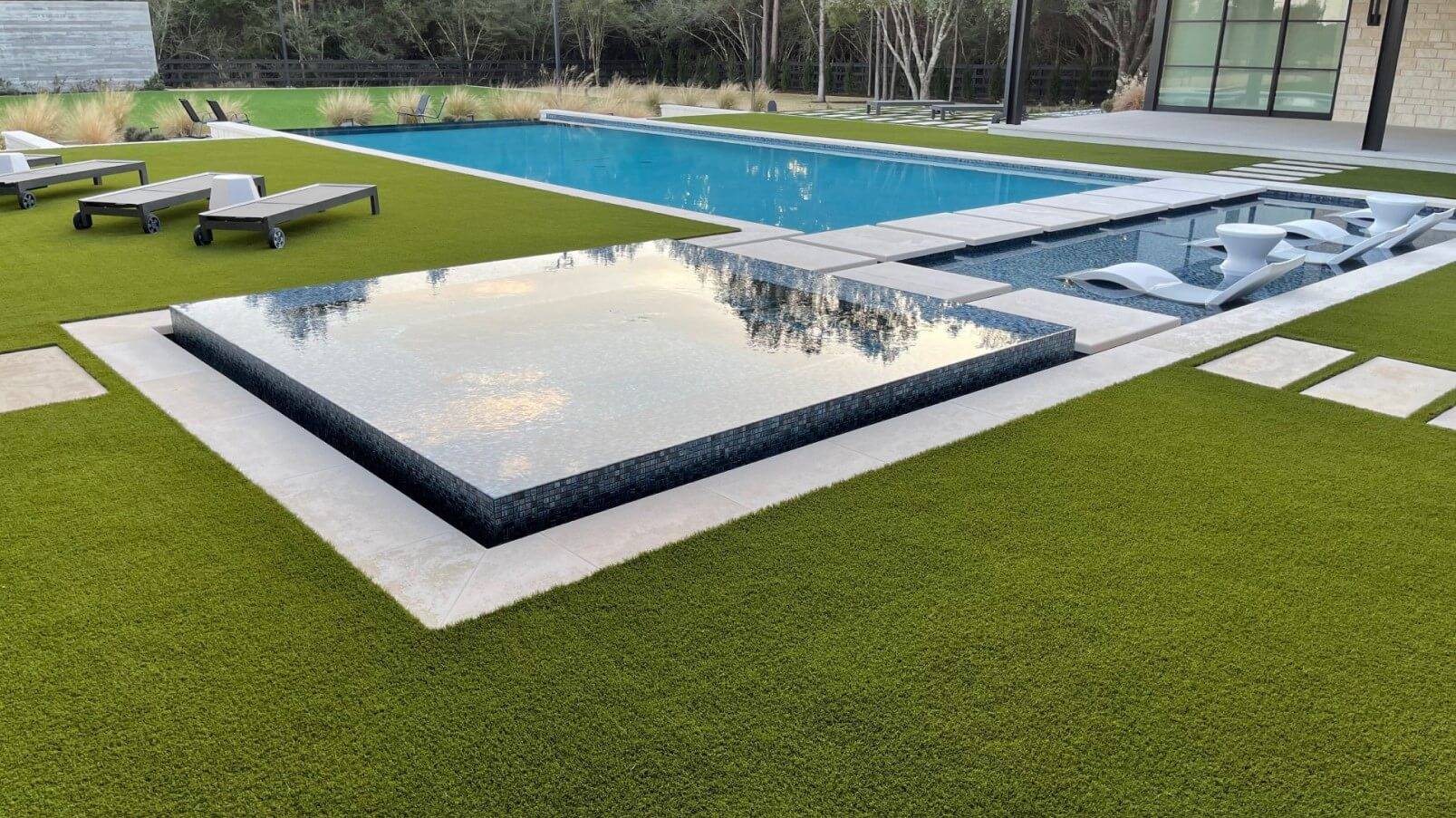 Residential artificial turf installation with pool in Denton, TX